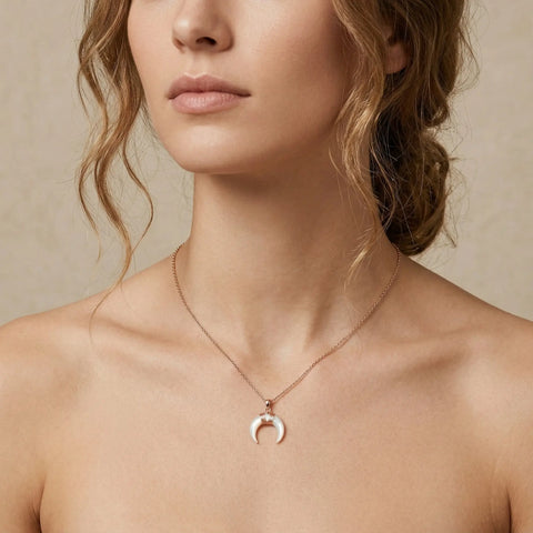 woman wearing gold crescent moon necklace with white pendant, minimal boho jewelry for women, Woodstock Zambon
