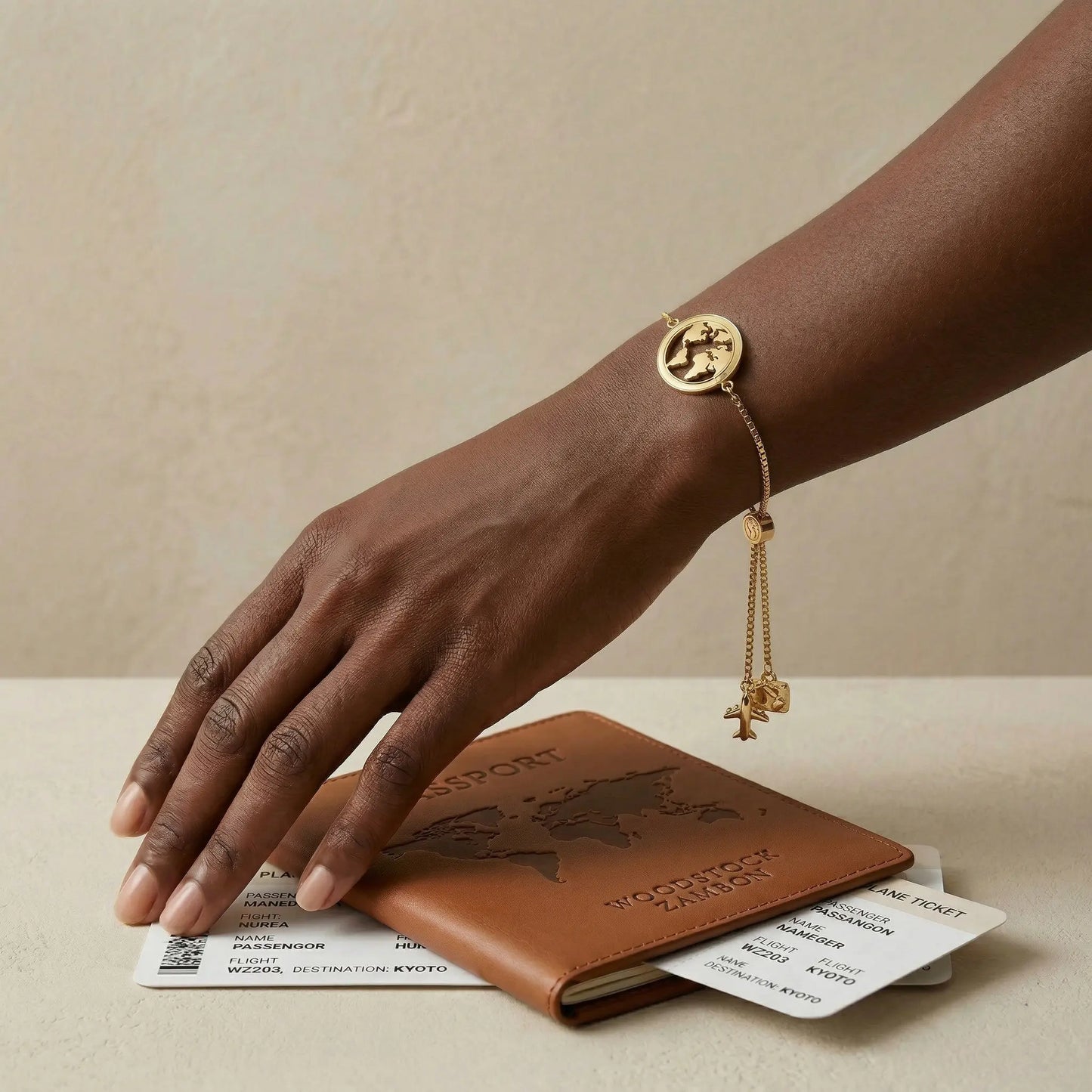 18k gold plated world map bracelet with airplane charm for women, waterproof stainless steel travel jewelry on wrist with passport and boarding pass