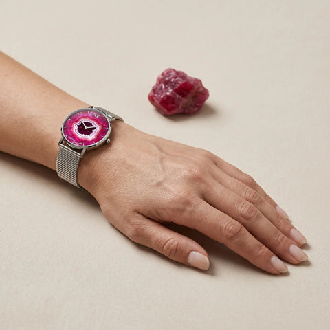 Ruby geode inspired waterproof watch in stainless steel. Designed for everyday elegance with a vibrant crystal-inspired dial and durable 5 ATM water resistance.