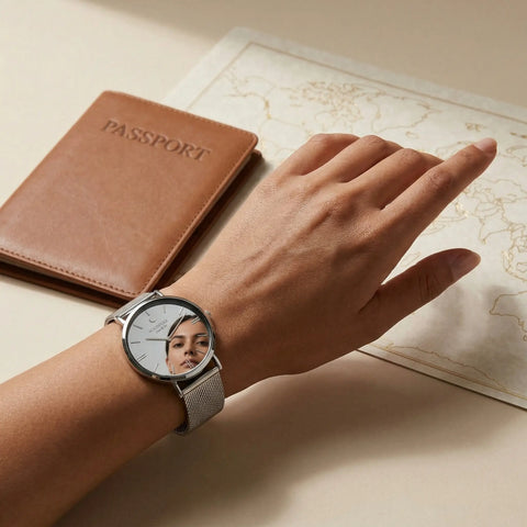 Silver mirror watch by Woodstock Zambon with reflective dial showing face reflection, styled with passport and world map