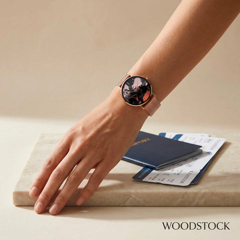 Women's waterproof 18K rose gold watch with black reflective world map dial Woodstock Zambon worn on wrist