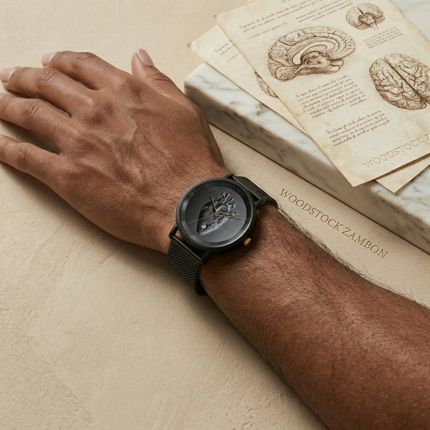 Woodstock Zambon total black watch with anatomical heart on dial, vintage anatomy medical illustrations with skulls and brains in background, editorial style.