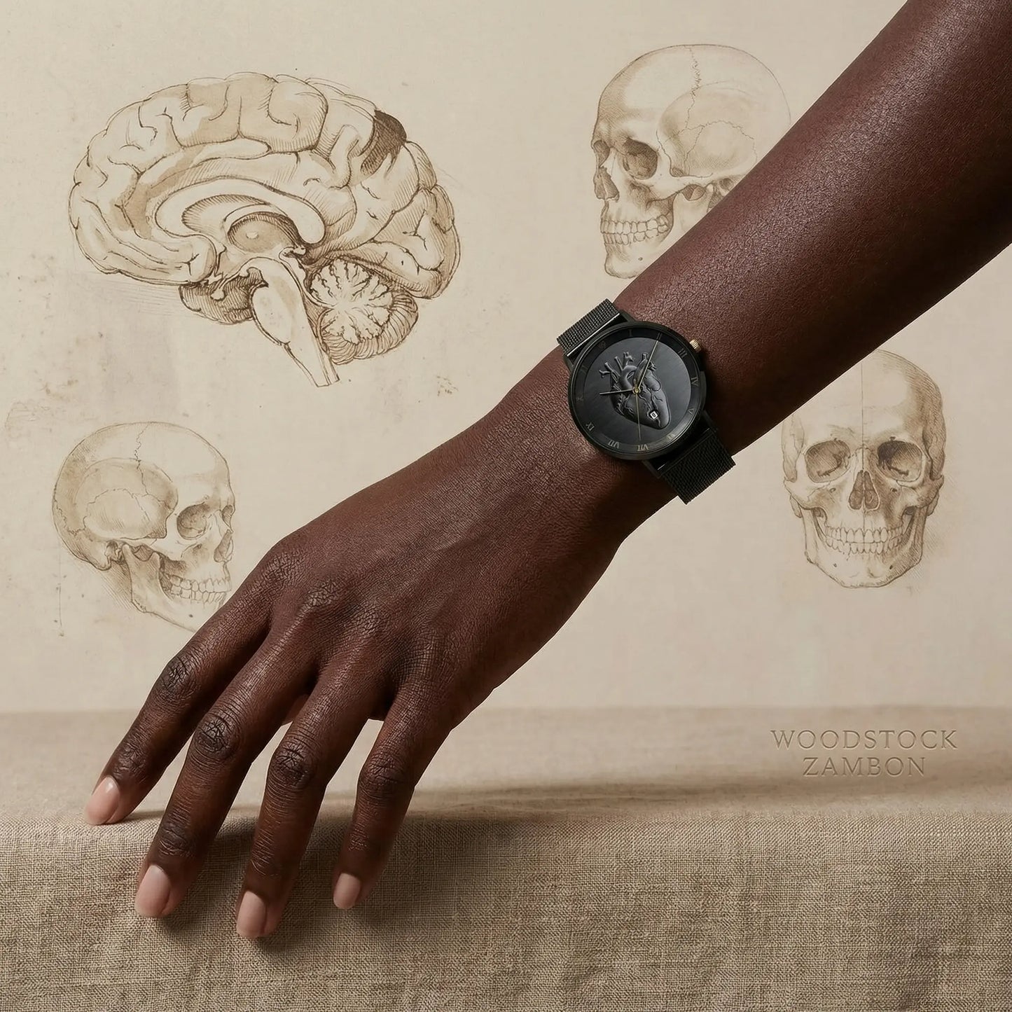 Woodstock Zambon total black watch with anatomical heart on dial, vintage anatomy medical illustrations with skulls and brains in background, editorial style.